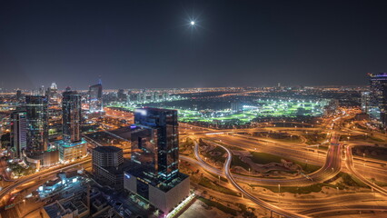 Fototapeta na wymiar Panorama showing Dubai marina and JLT skyscrapers along Sheikh Zayed Road aerial night timelapse.