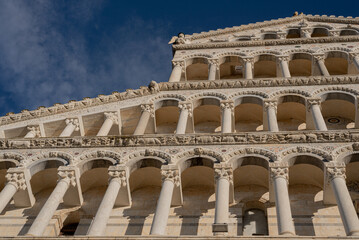 detail of the facade of an ancient building in Pisa