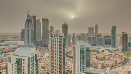 Aerial panoramic sunrise over big futuristic city timelapse. Business bay and Downtown