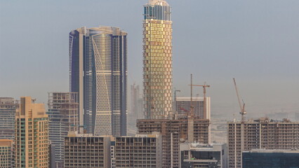 Fototapeta na wymiar Aerial panoramic skyline of a big futuristic city timelapse. Business bay and Downtown