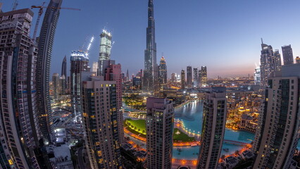 Fototapeta na wymiar Panorama of Dubai Downtown cityscape with tallest skyscrapers around aerial night to day timelapse.