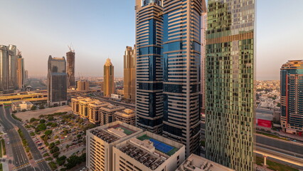 Aerial view of Dubai International Financial District with many skyscrapers timelapse.