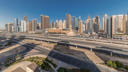 Naklejka na ściany i meble Panorama showing Dubai Marina skyscrapers and Sheikh Zayed road with metro railway, United Arab Emirates