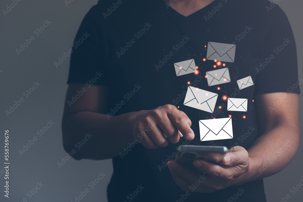 Poster concept email marketing and newsletter. new email messages on mobile smart phone, hands of a busines
