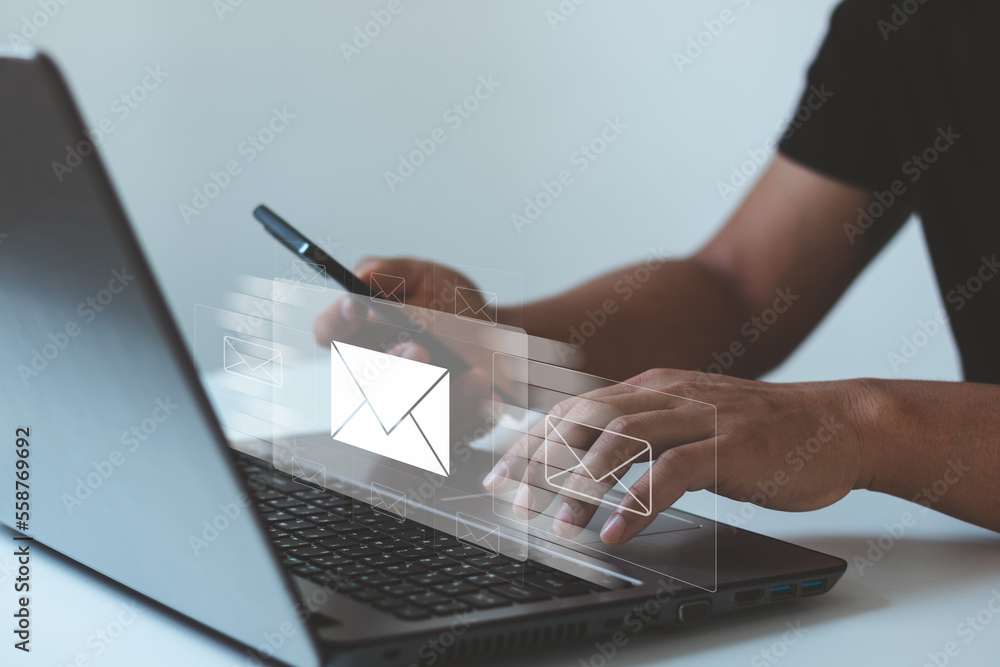 Poster businessman hands using laptop computer typing on keyboard and surfing the internet on office table 