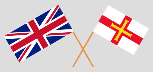 Crossed flags of United Kingdom and Bailiwick of Guernsey. Official colors. Correct proportion