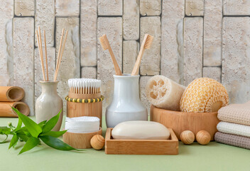 Bamboo bathroom accessories. Toothbrush, cotton swabs, cotton pads, soap dish, soap, towel, loofah...