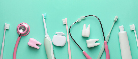 Set for oral hygiene and stethoscope on turquoise background