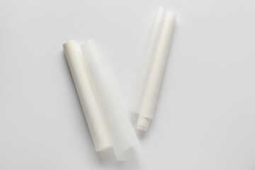 Rolls of baking paper on white background