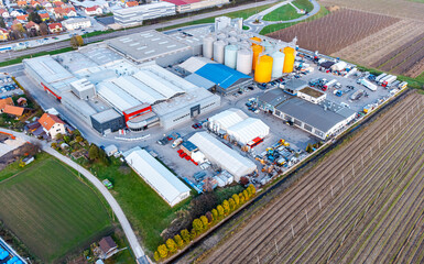 Aerial view of a industrial lot with warehouses and silos