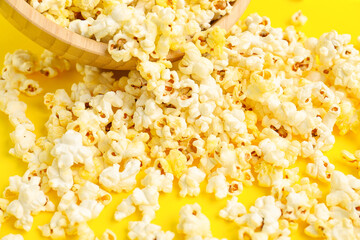 Tasty popcorn on yellow background, closeup
