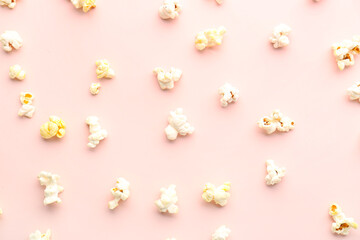 Tasty popcorn on pink background