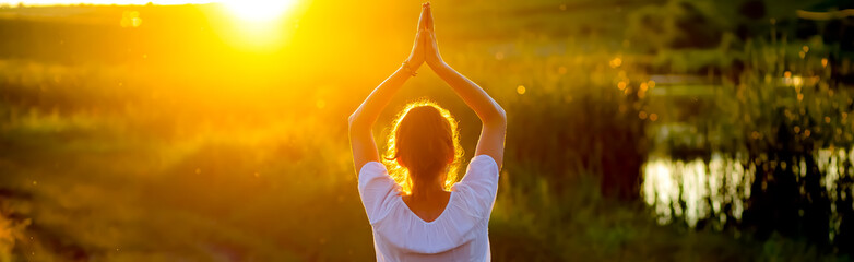 woman in a yoga pose at sunset by lakeside mindfulness and mental health
