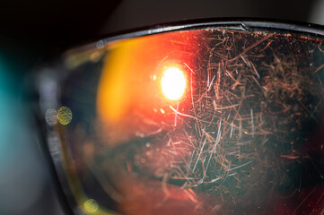 macro of the scratched surface of a polarized sunglasses lens