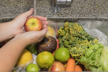 hands washing vegetables