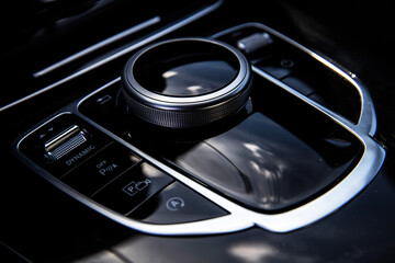 automatic gear lever in a premium car and glossy inserts around