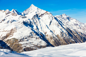 Naklejka premium View of the picturesque mountain peaks in winter, located near the popular resort of Zermatt, Switzerland