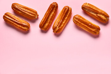 Sweet eclairs on pink background