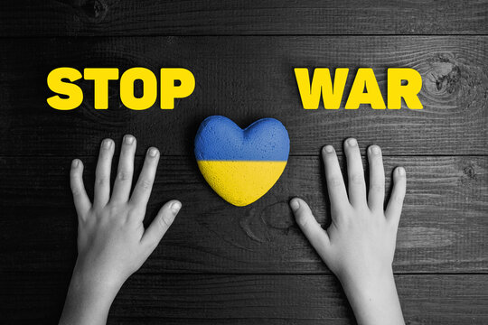 child hands with ukraine heart