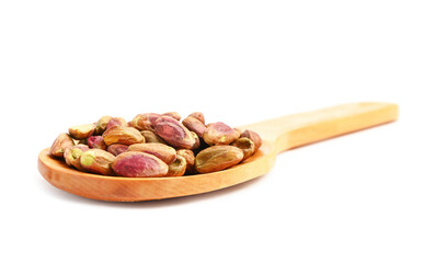 Wooden spoon with tasty pistachio nuts isolated on white background