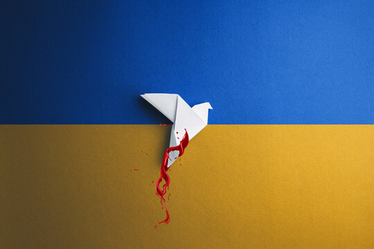white paper bird painted blood red