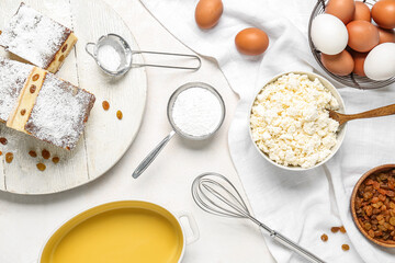 Ingredients for preparing cheese pie on white background
