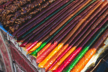 View of traditional armenian local candy sweets delights with churchkhela, sweet sausage, sudzhuk, dried fruits, walnuts and others for sale in a local vendor souvenir shop kiosk of Yerevan, Armenia