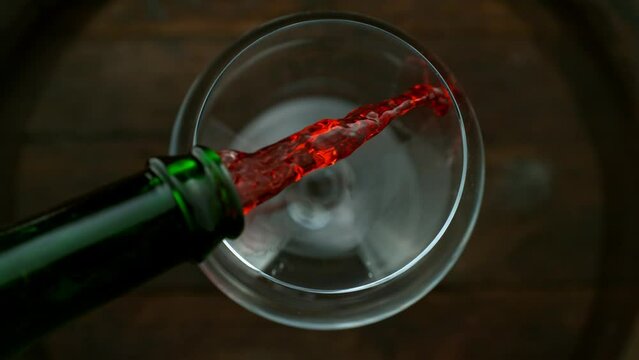 Super slow motion of pouring red wine with camera motion. Speed ramp effect. Filmed on high speed cinema camera with cinebot, 1000 fps.
