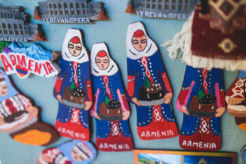 View of traditional tourist souvenirs, presents and gifts from Armenia, fridge magnets with text...