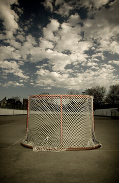 An ice Hockey net ready for summer use stis on empty on cement in Toronto, Ontario.