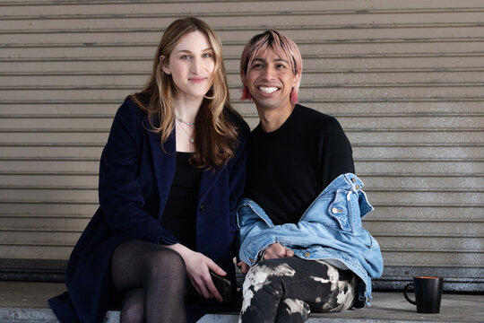  Lgbtqia friends sitting and posing together.