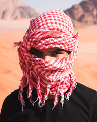 arab man in the desert in wadi rum jordan