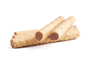 Tasty wafer rolls with boiled condensed milk isolated on white background