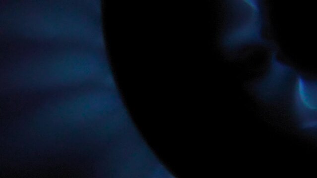Top-Down Super Closeup Macro shot of a blue flame gas burner
