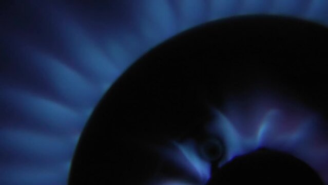 super closeup gas stoves. Macro shot of a blue flame gas burner