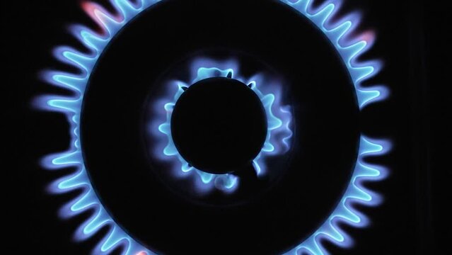 Turning on the stove switch Top-Down Slow motion footage Closeup