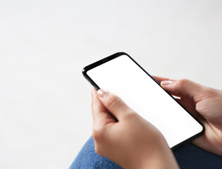 Closeup view of woman with smartphone indoors. Space for text