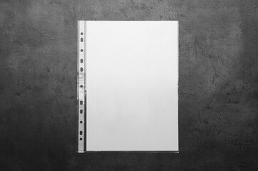 Punched pocket with paper sheet on grey background top view