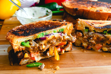 Toasted Korean Steak Sandwich with Jalapenos and Garlic Mayo: Sliced grilled cheese stuffed with...