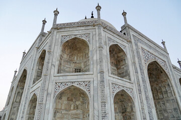 Fototapeta na wymiar Taj Mahal in Agra, India. Taj Mahal main mausoleum with carvings of Arabic calligraphy (inscriptions) decorated with the black marble.