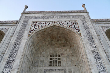 Taj Mahal in Agra, India. Taj Mahal main mausoleum with carvings of Arabic calligraphy...