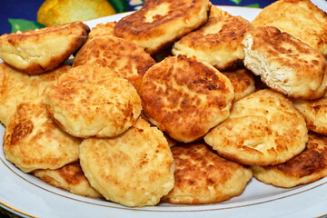 fried cheese cakes served on a plate
