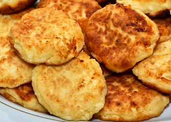 fried cheese cakes served on a plate