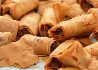 Phillipine Lumpia fried meat rolls on a platter
