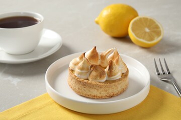 Delicious lemon meringue pie served on white table