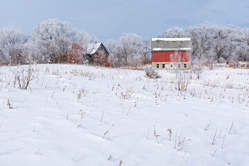 snowy field and barns of rural prairie landscape in mendota heights minnesota