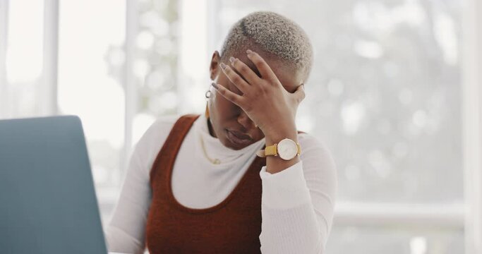 Burnout, stress and professional black woman on a laptop working on project with a deadline. Overworked, frustration and African business employee with a headache doing research on computer in office