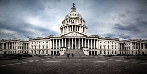 Panoramic view of rear facade of Capitol building in Washington, D.C. on a cloudy and moody day....