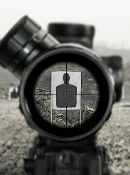 Sniper rifle scoping target view, image of a rifle scope sight used for aiming with a sniper weapon rifle at shooting range