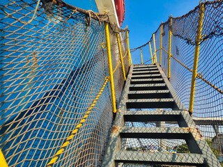 Stairway to heaven, Steep ladders, vessel gangway with nets on either side connect the ship and the...